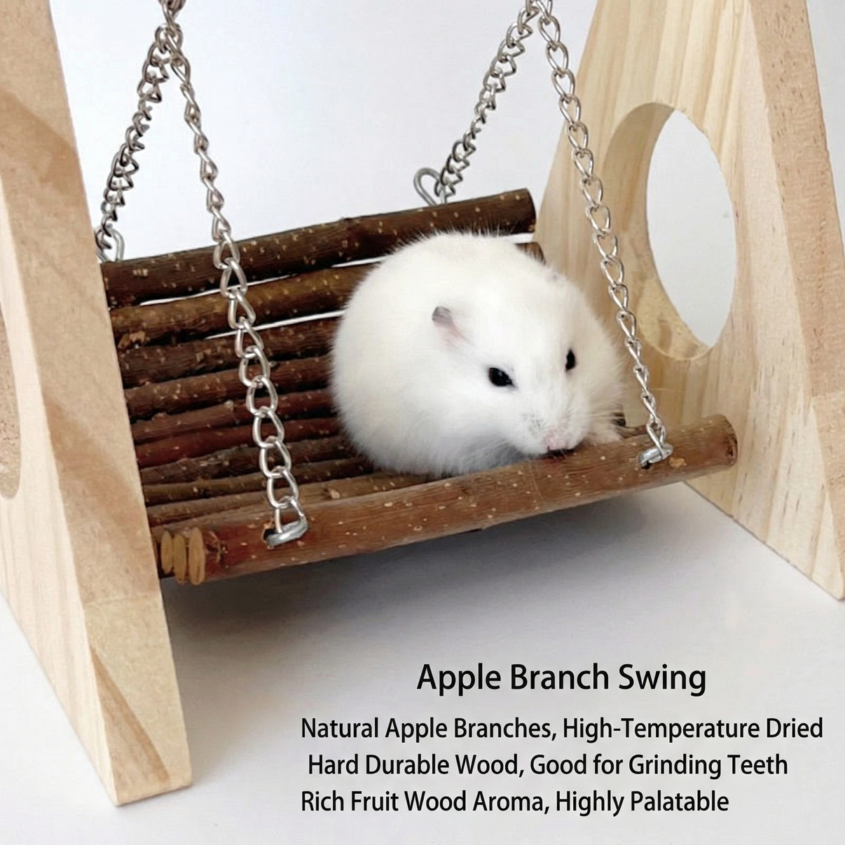 White hamster sitting on wooden apple branch swing with chains for small pet cages.