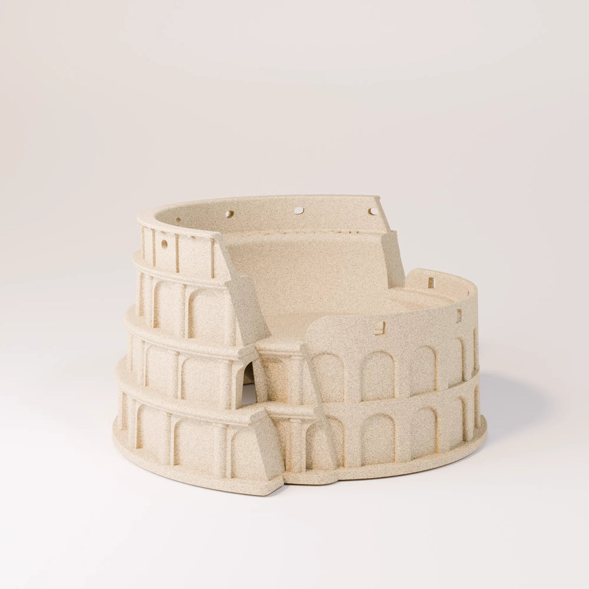 Beige reptile hideout shaped like a miniature Colosseum for terrarium decor